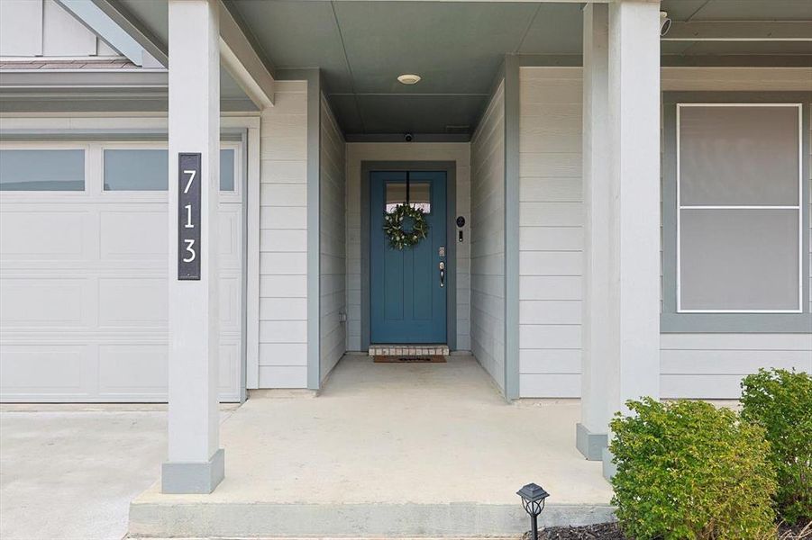 Property entrance with an attached garage