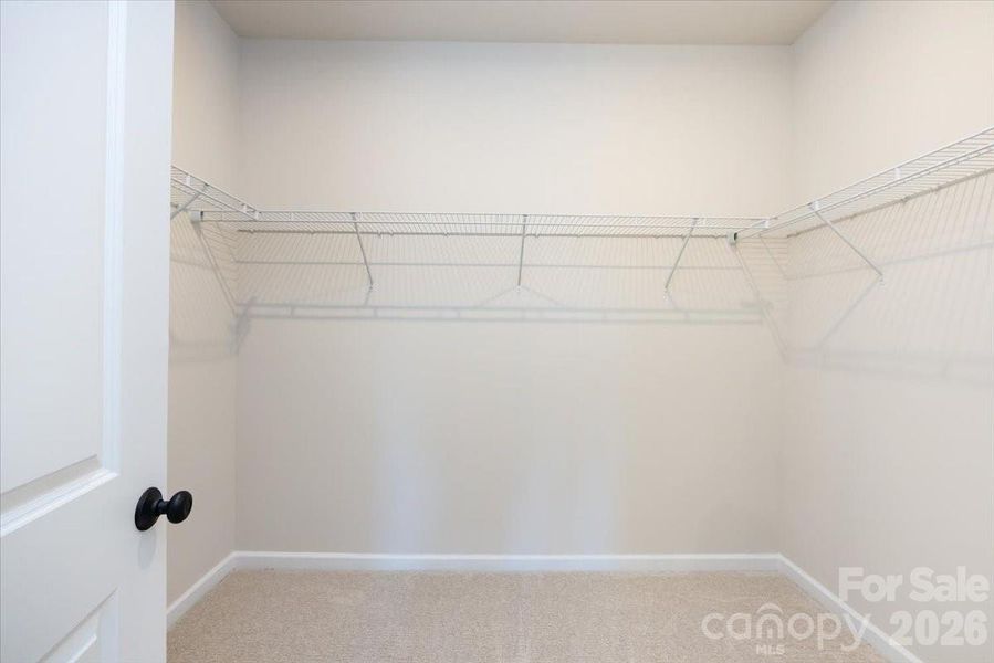 Primary Walk-in Closet Primary Walk-in Closet
