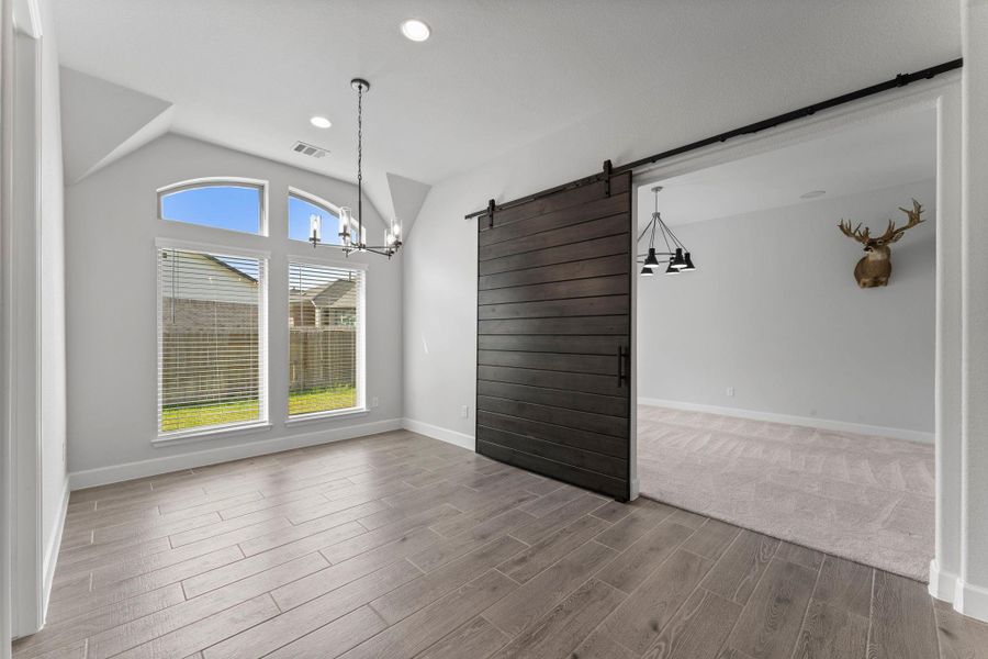 Game room/media room with upgraded barn door just off morning area. Game room/media room with upgraded barn door just off morning area.
