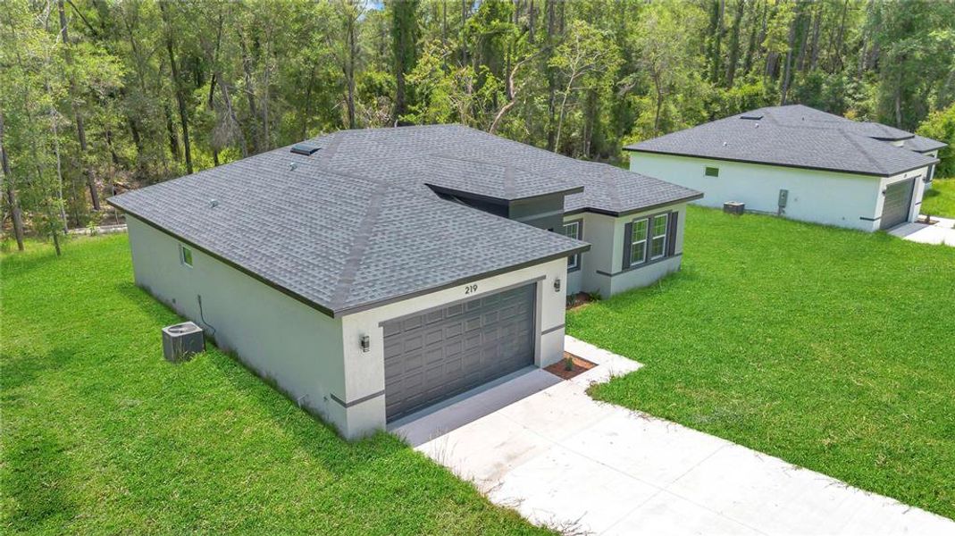Front exterior of a new home in , Dunnellon, FL, highlighting curb appeal (Image 1). Front exterior of a new home in , Dunnellon, FL, highlighting curb appeal (Image 1).