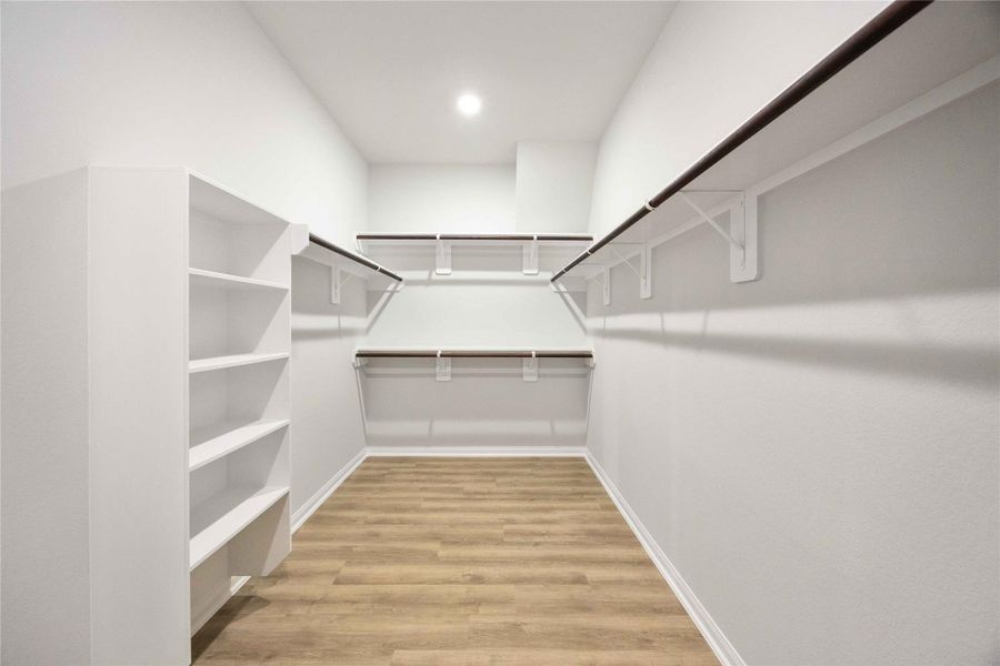 The primary closet features built-in shelving and clothes hanging rods to take your closet storage and organization to the next level. The primary closet features built-in shelving and clothes hanging rods to take your closet storage and organization to the next level.