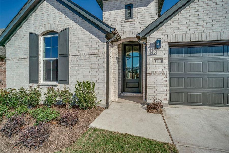 Exterior details and patio area of a home in West Crossing, Anna (Image 3).