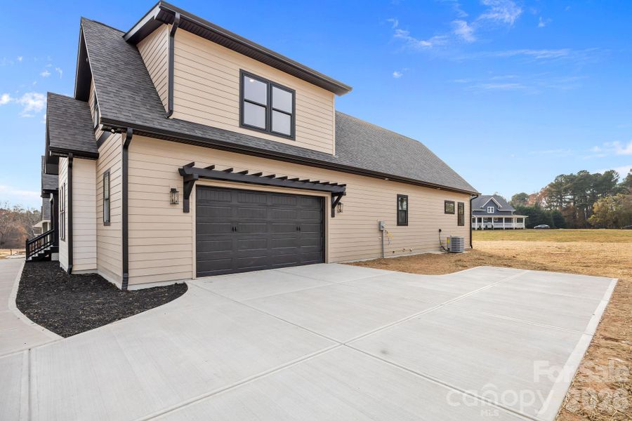 Exterior details and patio area of a home in , Statesville (Image 31).