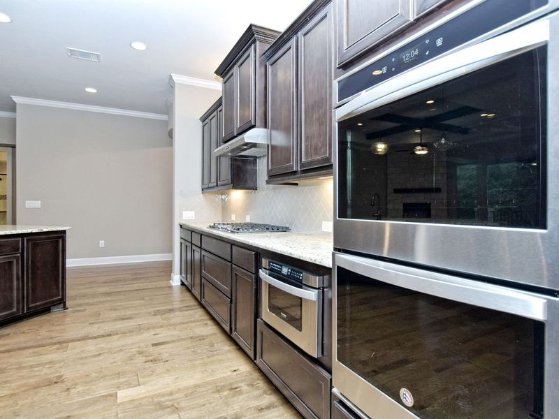 Representative furnished interior of a home built from the Madera II by Giddens Homes in Scofield Farms Estates, Georgetown (Image 261).