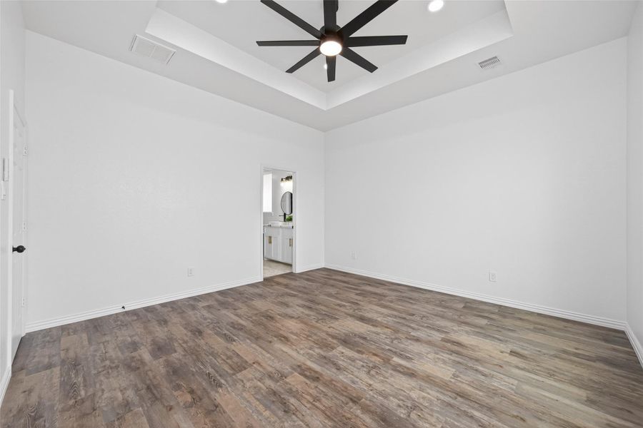 Expansive primary suite with high ceilings and plenty of natural light.