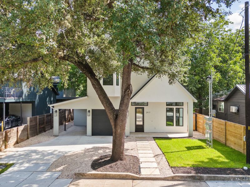 View of front of property with driveway, an attached garage, and stucco siding View of front of property with driveway, an attached garage, and stucco siding