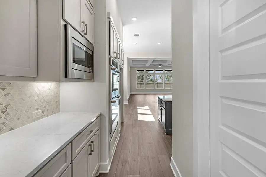 Furnished interior view inside a new home in Bridgeland, Cypress (Image 5).