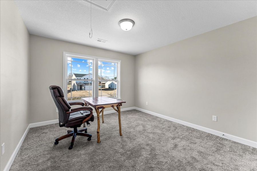 Representative furnished interior of a home built from the Sumter by Enchanted Homes in Lonesome Dove, San Antonio (Image 8).