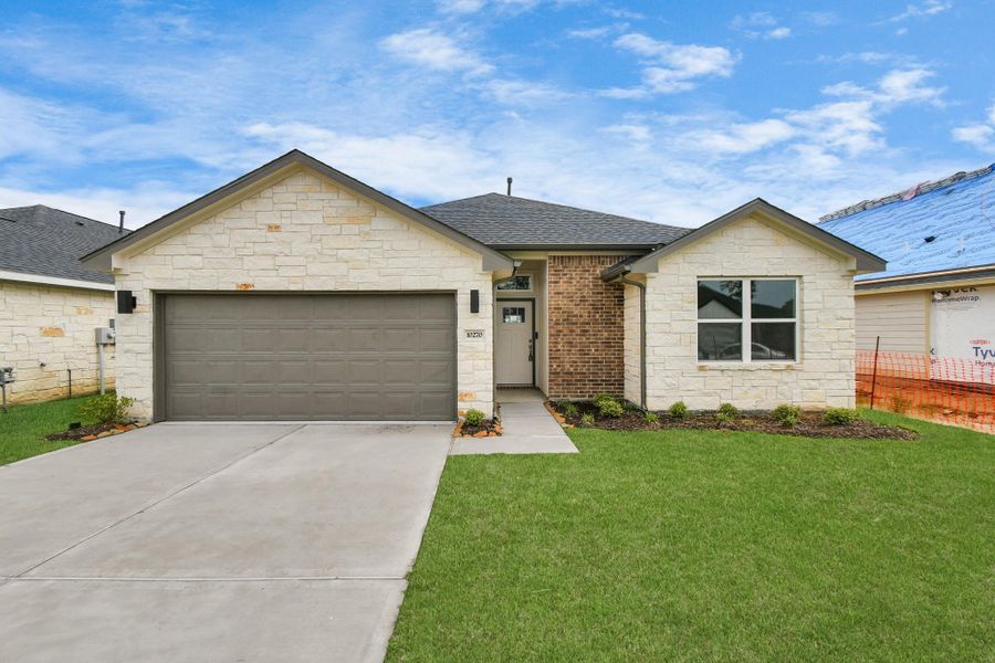 Front exterior of a new home in Grand Oaks Reserve, Cleveland, TX, highlighting curb appeal (Image 1). Front exterior of a new home in Grand Oaks Reserve, Cleveland, TX, highlighting curb appeal (Image 1).