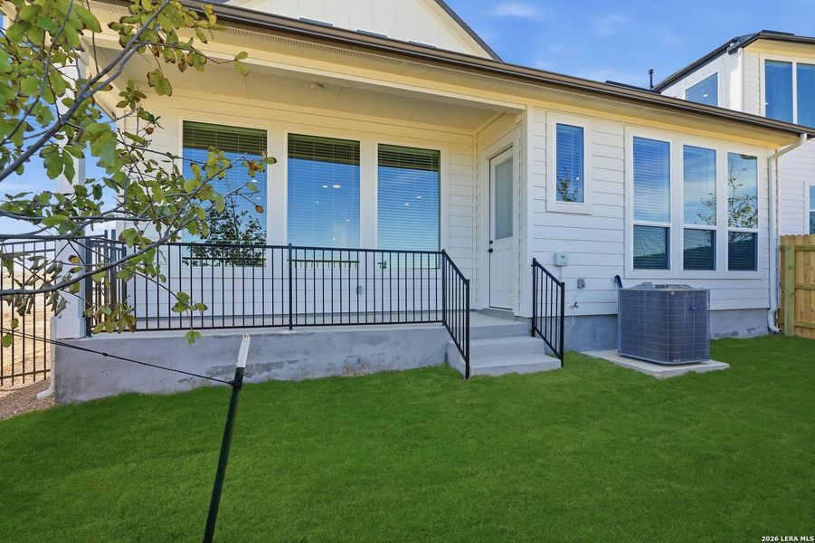 Exterior details and patio area of a home in Prominence, San Antonio (Image 24).