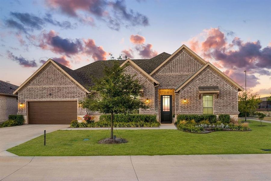 Front exterior of a new home in Ladera Prosper, Prosper, TX, highlighting curb appeal (Image 1).