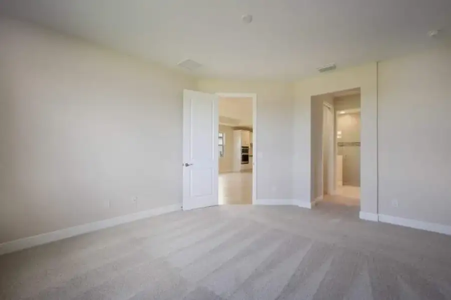 Representative unfurnished interior of a home built from the Boca Grande by Medallion Home in Reflection Villas at Watercolor Place, Bradenton (Image 18).