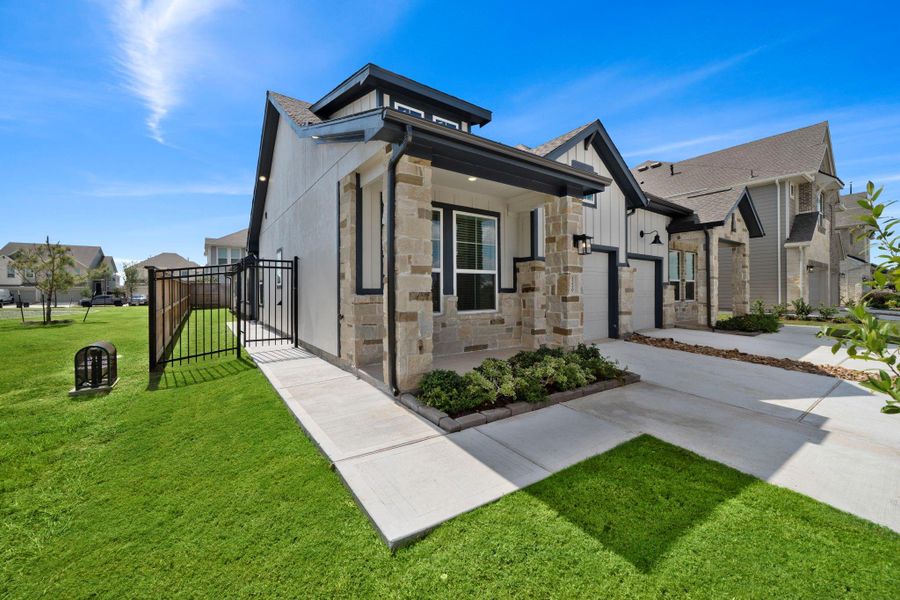 Exterior details and patio area of a home in Meridiana, Iowa Colony (Image 16).