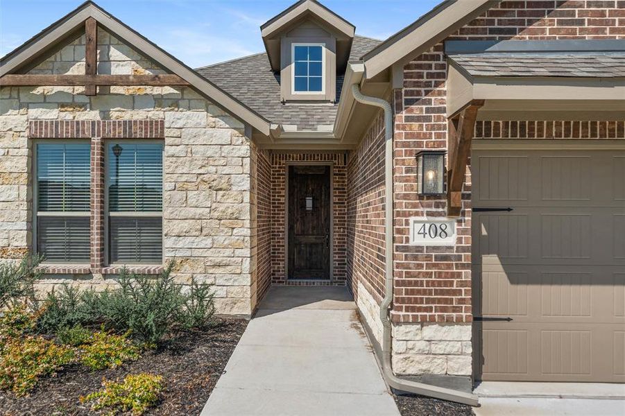 Front exterior of a new home in Aero Vista, Caddo Mills, TX, highlighting curb appeal (Image 22). Front exterior of a new home in Aero Vista, Caddo Mills, TX, highlighting curb appeal (Image 22).