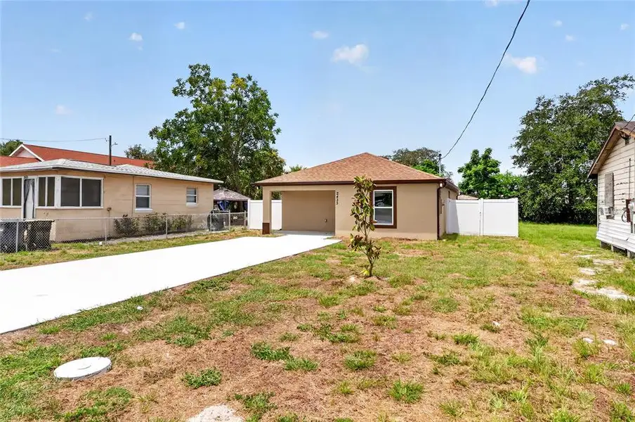 Front exterior of a new home in , Winter Haven, FL, highlighting curb appeal (Image 22). Front exterior of a new home in , Winter Haven, FL, highlighting curb appeal (Image 22).