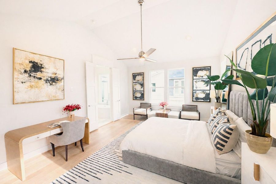Vaulted Ceilings in Primary Bedroom.    Wide Plank Wood Floors.  (picture was virtually enhanced)