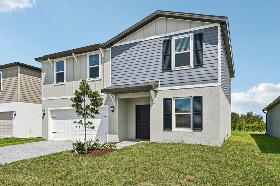 Front exterior of a home in the Meritage Homes at Terra Lago - Classic Series community, located in Indiantown, FL (Image 12).