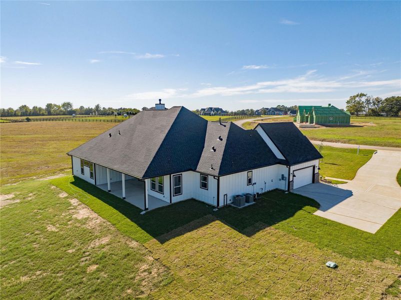 Expansive back porch with scenic views