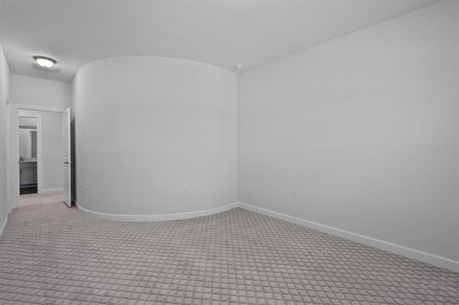 Carpeted empty room featuring baseboards Carpeted empty room featuring baseboards
