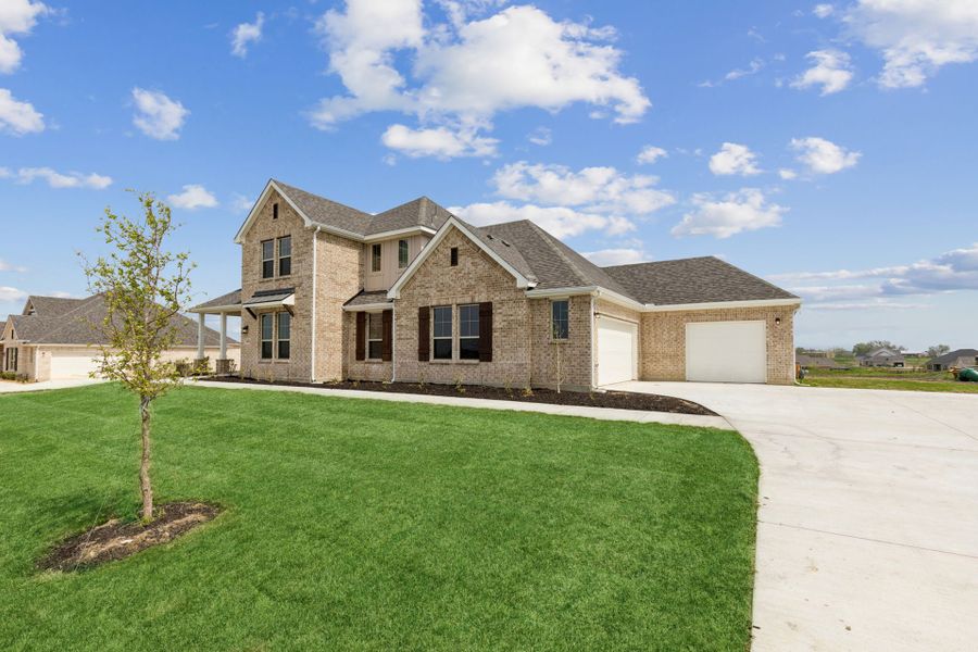 Front exterior of a new home in Ellis Ranch Estates, Waxahachie, TX, highlighting curb appeal (Image 23).