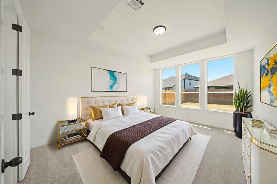 Primary bedroom. "Note: Sample product photo. Actual exterior and interior selections may vary by homesite. Photo may be virtually staged"