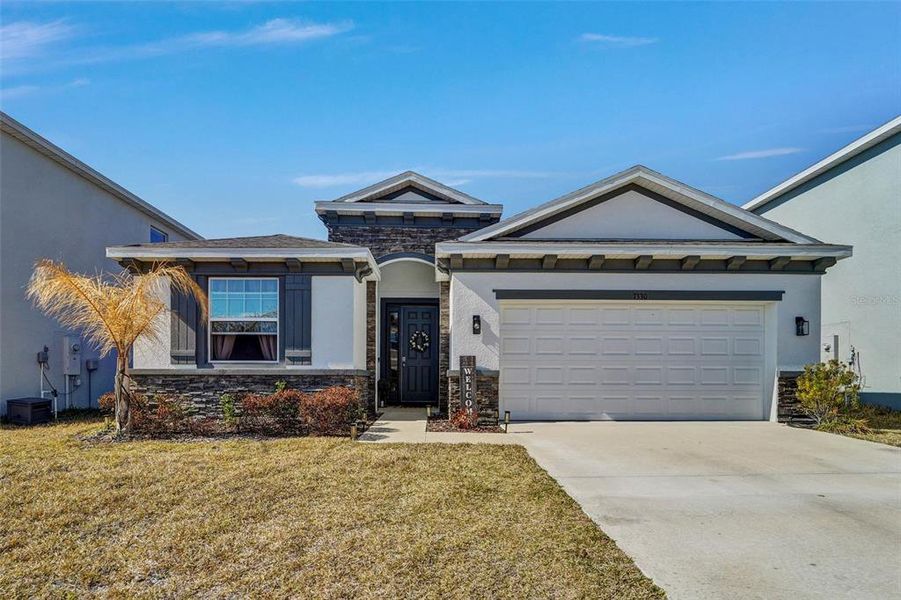 Front exterior of a new home in Waterford, Brooksville, FL, highlighting curb appeal (Image 22).