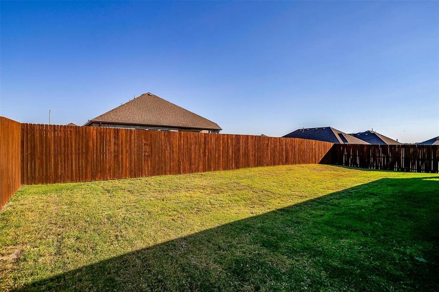 Large level yard, fully fenced with sprinkler system