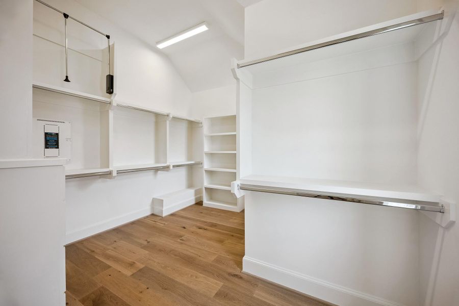 Exceptional primary closet with extensive built-in shelving, cabinetry and storage.  This is the smaller of the two!