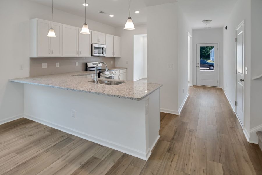 Furnished interior view inside a new home in Marlin Pointe, White House (Image 2).