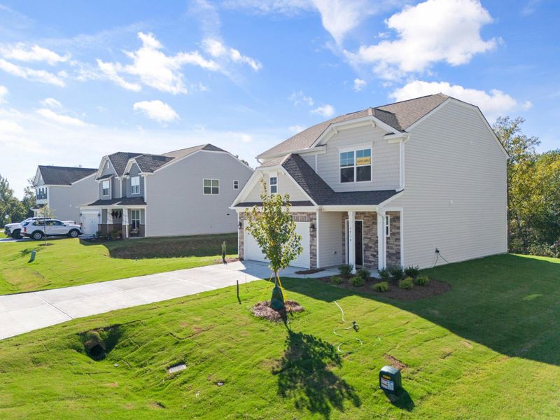 Front exterior of a new home in Cottages at Piper Village, Trinity, NC, highlighting curb appeal (Image 2).