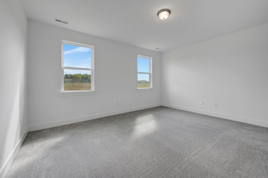 Spacious, unfurnished interior of a new home in McAlister Creek, Clayton (Image 21).