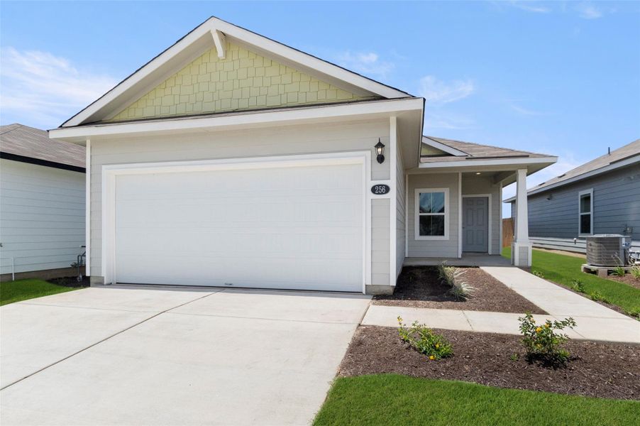 View of front of property with a garage and concrete driveway View of front of property with a garage and concrete driveway