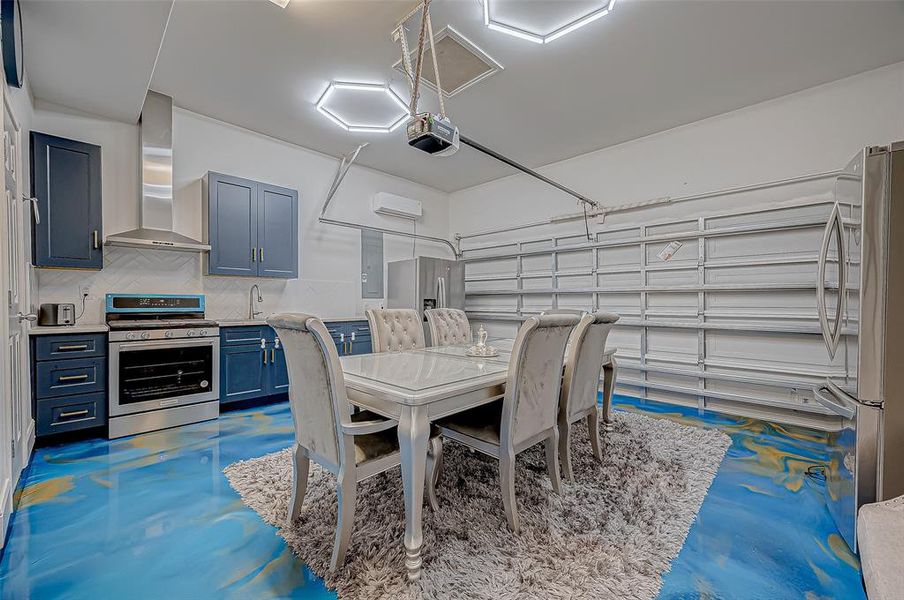 Converted garage spice kitchen with epoxy flooring is ideal for culinary enthusiasts.