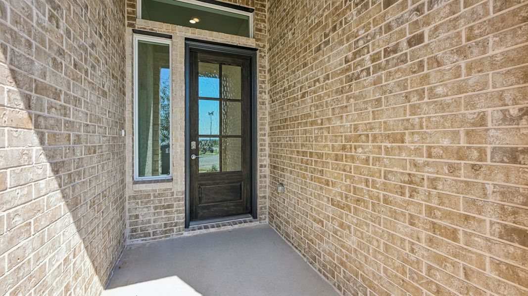 Exterior details and patio area of a home in The Enclave at Bar W Ranch, Leander (Image 3). Exterior details and patio area of a home in The Enclave at Bar W Ranch, Leander (Image 3).