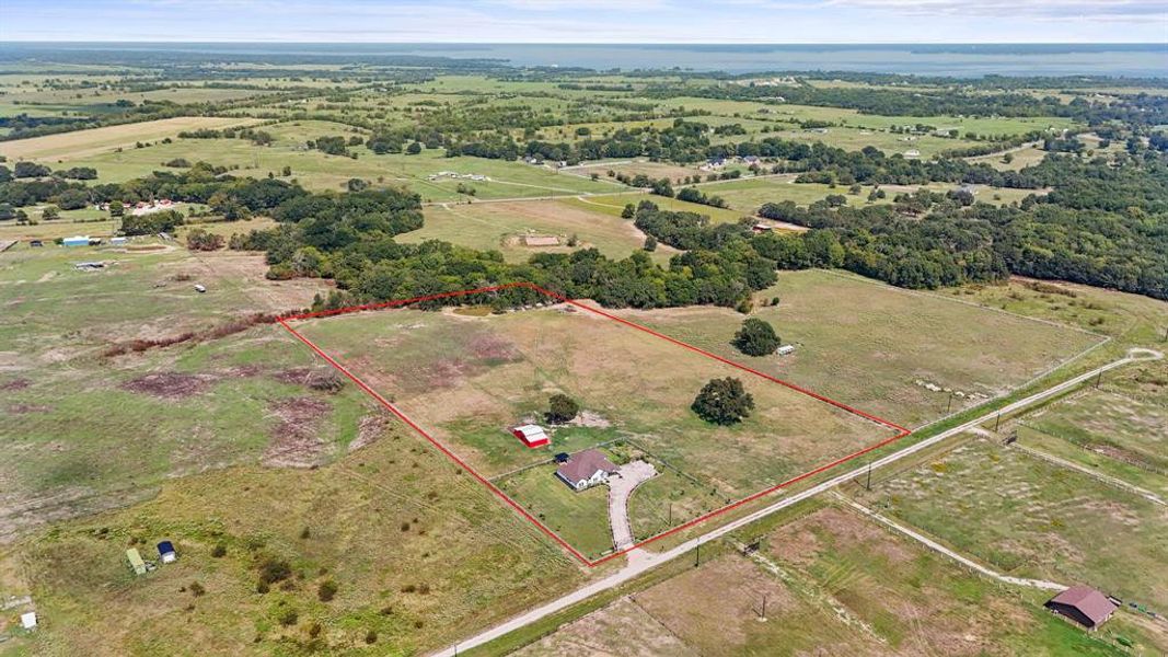 Aerial view of sparsely populated area with property boundaries highlighted Aerial view of sparsely populated area with property boundaries highlighted