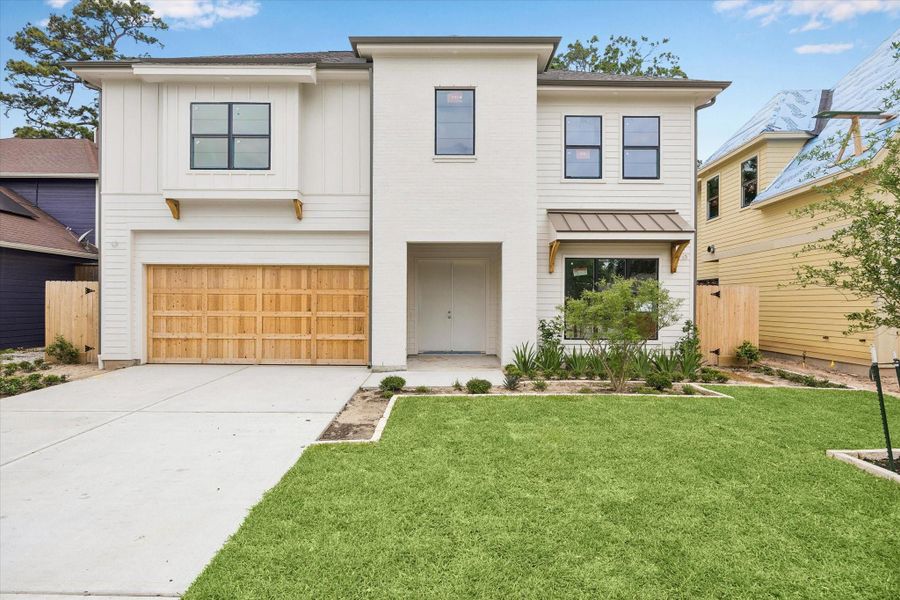 Clean modern lines meet timeless materials in this Oak Forest new construction by Harvard Homes. Painted brick, vertical siding, Low E double paned windows, and a cedar garage door create standout curb appeal on a 7,923 square foot lot. Clean modern lines meet timeless materials in this Oak Forest new construction by Harvard Homes. Painted brick, vertical siding, Low E double paned windows, and a cedar garage door create standout curb appeal on a 7,923 square foot lot.
