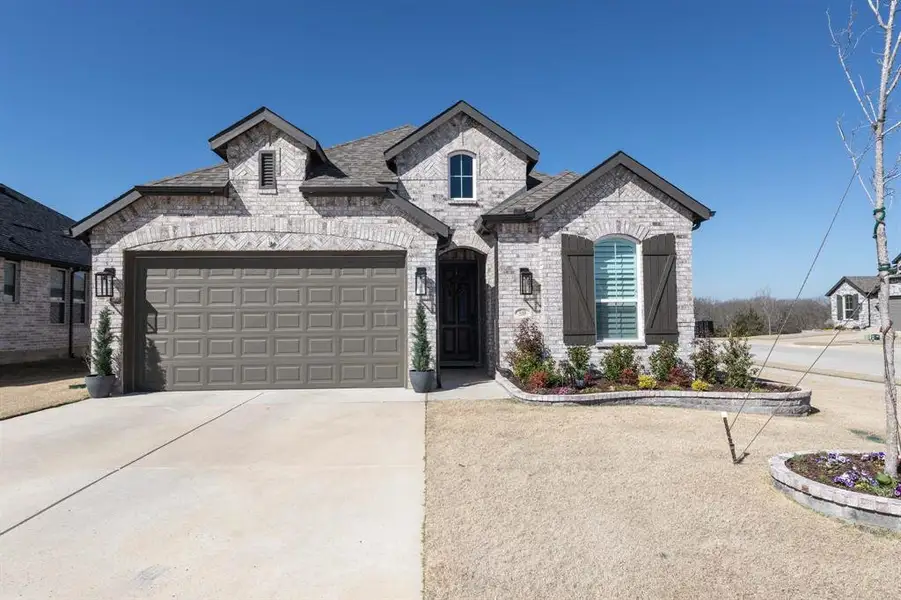 Front exterior of a new home in , Denison, TX, highlighting curb appeal (Image 1). Front exterior of a new home in , Denison, TX, highlighting curb appeal (Image 1).