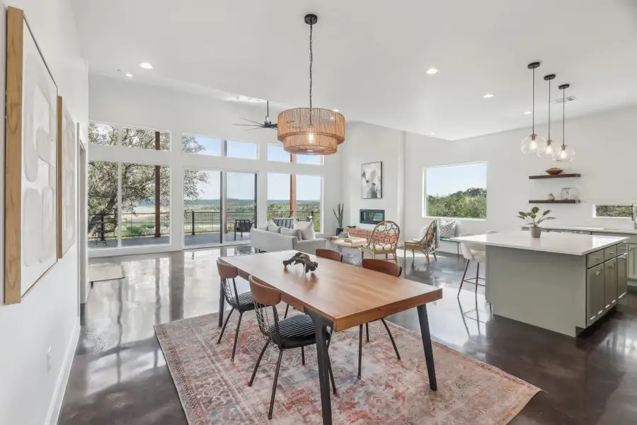 Dining area with finished concrete floors, recessed lighting, and a ceiling fan Dining area with finished concrete floors, recessed lighting, and a ceiling fan