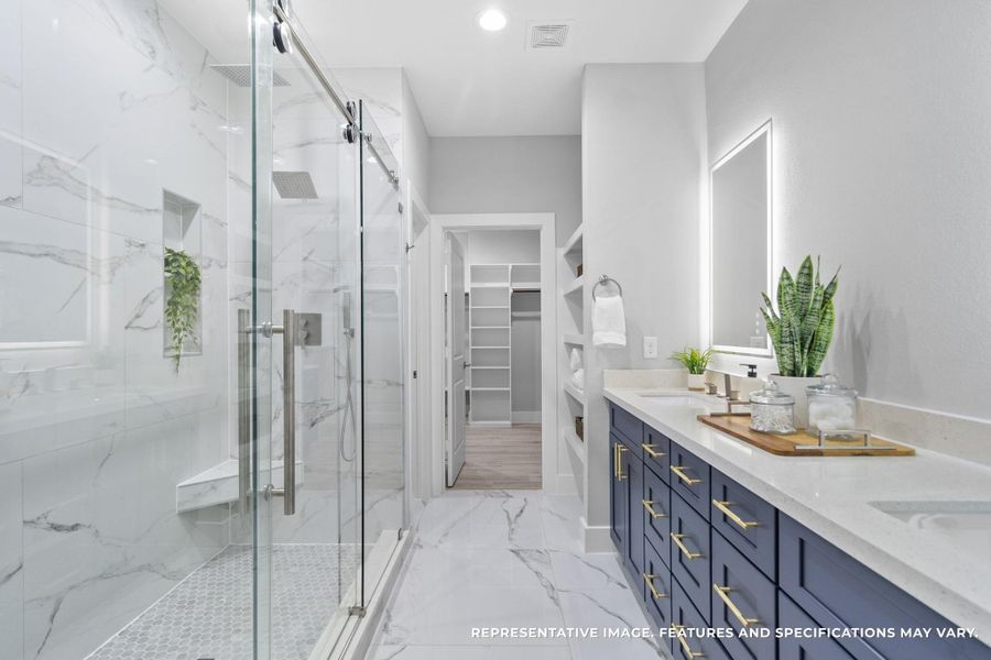 The walk-in shower, framed in glass and marble-style tile, gives you a daily dose of luxury while leading straight into your roomy closet. The walk-in shower, framed in glass and marble-style tile, gives you a daily dose of luxury while leading straight into your roomy closet.
