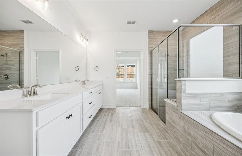 Spacious owner's bath with ample cabinet storage Spacious owner's bath with ample cabinet storage