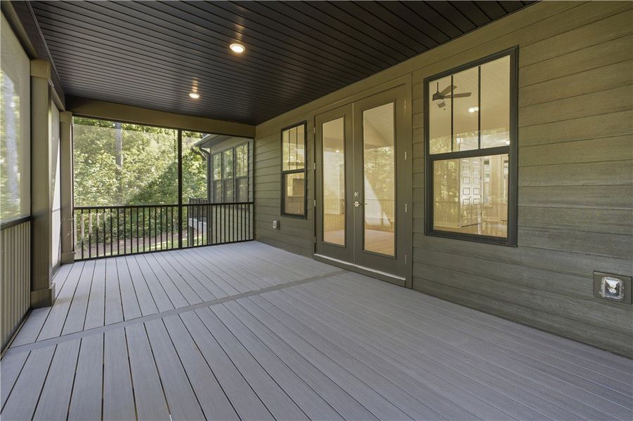 A spacious screened porch features composite decki