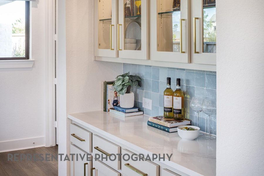 Bar area with backsplash and dark wood-type flooring Bar area with backsplash and dark wood-type flooring