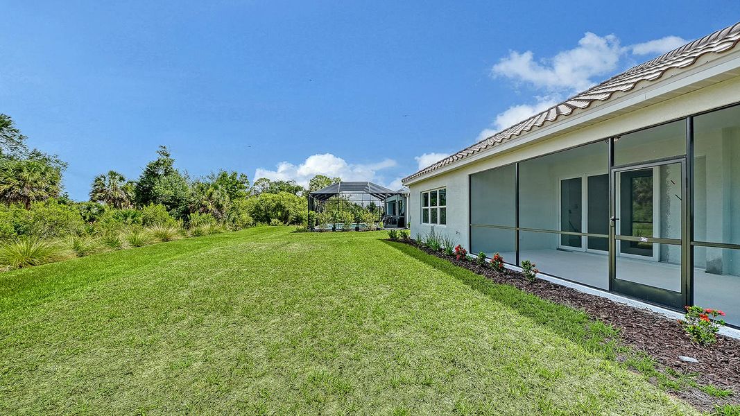Exterior details and patio area of a home in Grand Park Real Estate and Homes for Sale in Sarasota, FL - Neal Communities, Sarasota (Image 3).