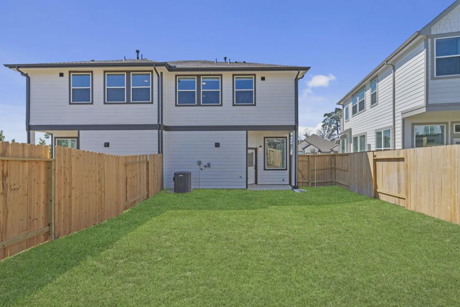 Exterior details and patio area of a home in Woodforest, Montgomery (Image 3).