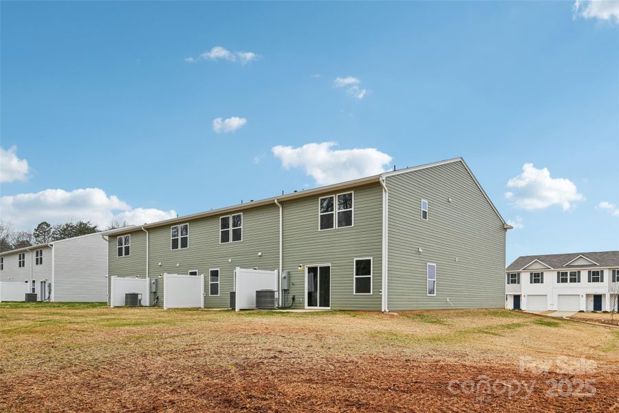 Exterior details and patio area of a home in The Towns at Green Needles, Lexington (Image 11).