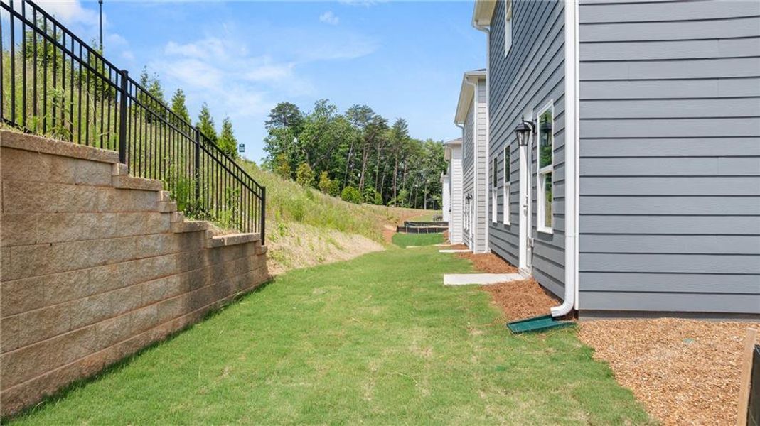 Exterior details and patio area of a home in The Bluffs, Canton (Image 4). Exterior details and patio area of a home in The Bluffs, Canton (Image 4).