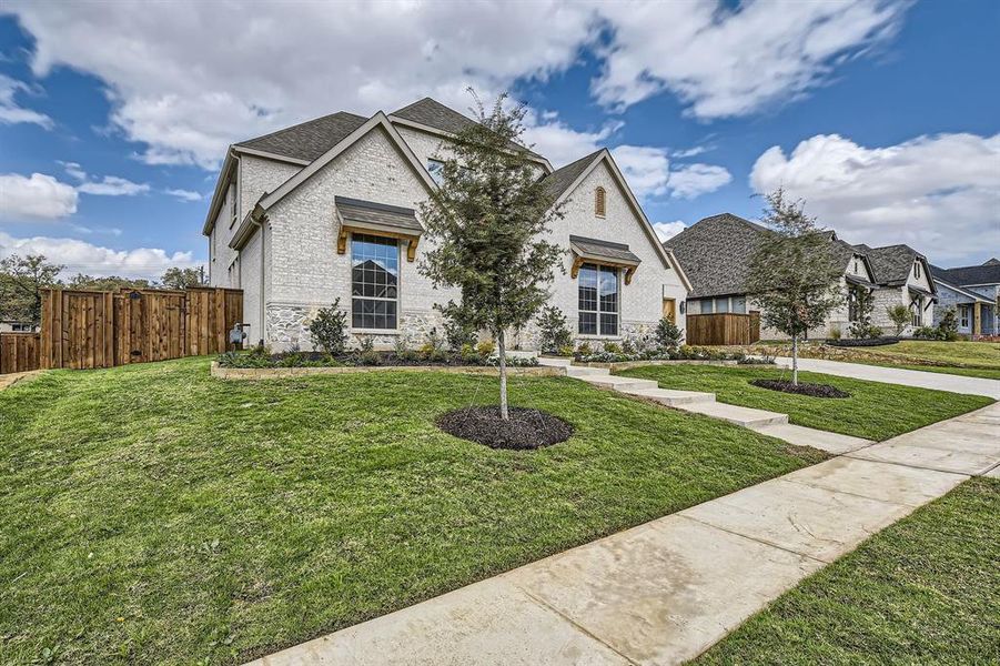 View of front of property with a front yard