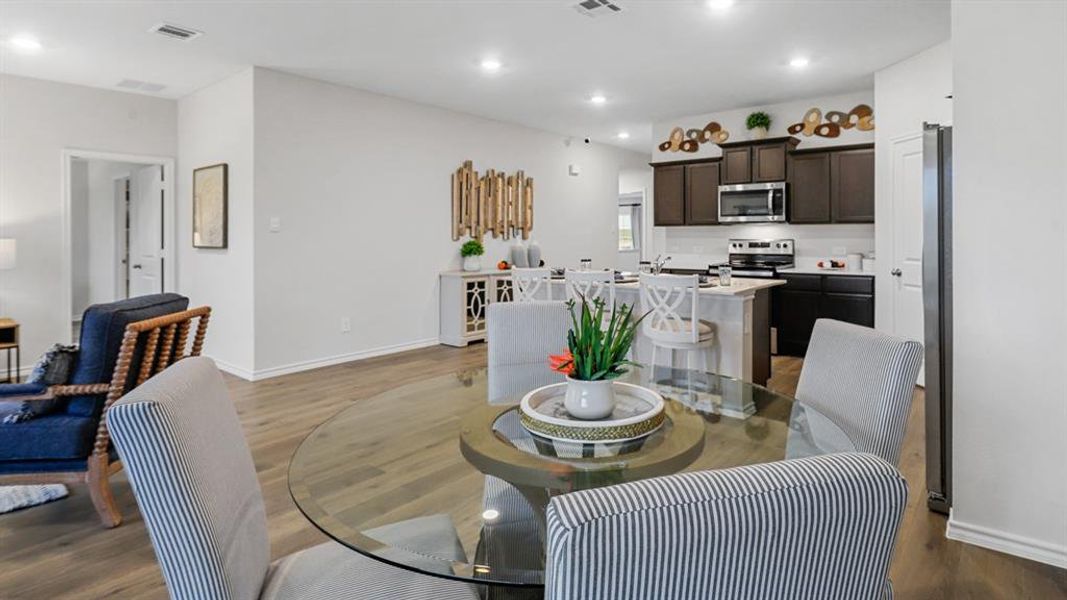 Dining area featuring recessed lighting and dark wood finished floors Dining area featuring recessed lighting and dark wood finished floors