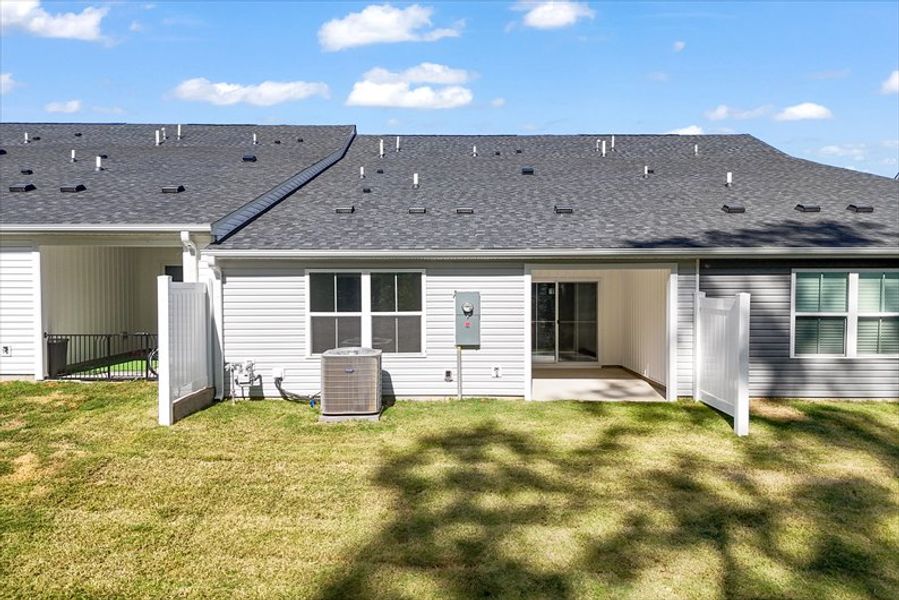 Exterior details and patio area of a home in Arden Woods Villas, Greenville (Image 1).