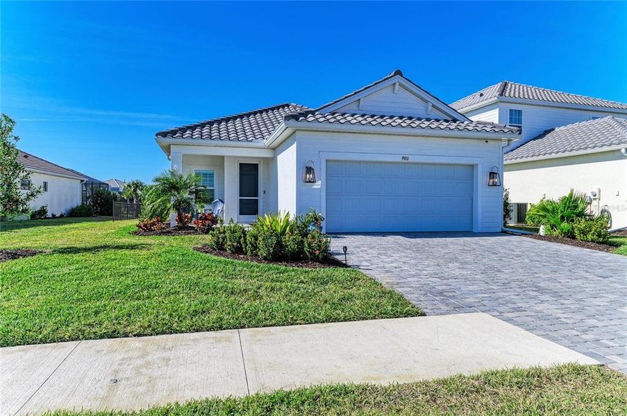 Front exterior of a new home in , Sarasota, FL, highlighting curb appeal (Image 25). Front exterior of a new home in , Sarasota, FL, highlighting curb appeal (Image 25).
